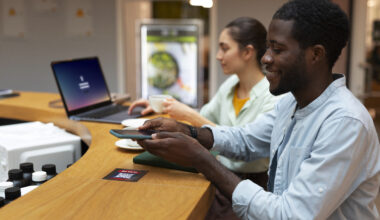 IT Jobs Pay 2025–2026. medium-shot-friends-medium-shot-friends-reading-menu-restaurant-scaled